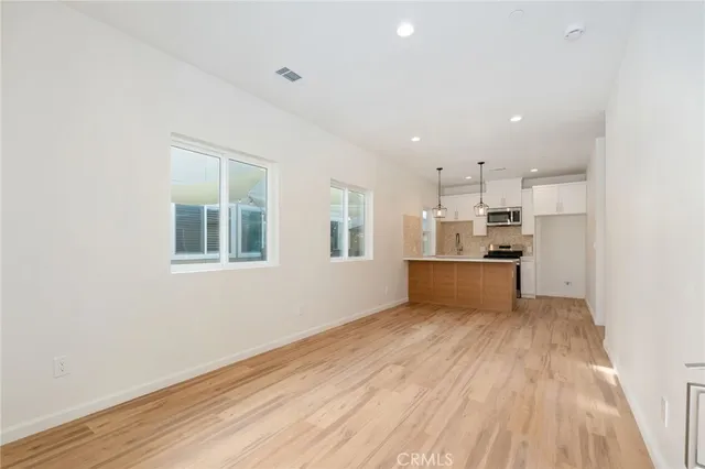 a view of kitchen with wooden floor