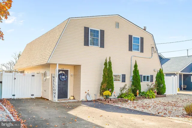 a kitchen with a sink refrigerator and cabinets