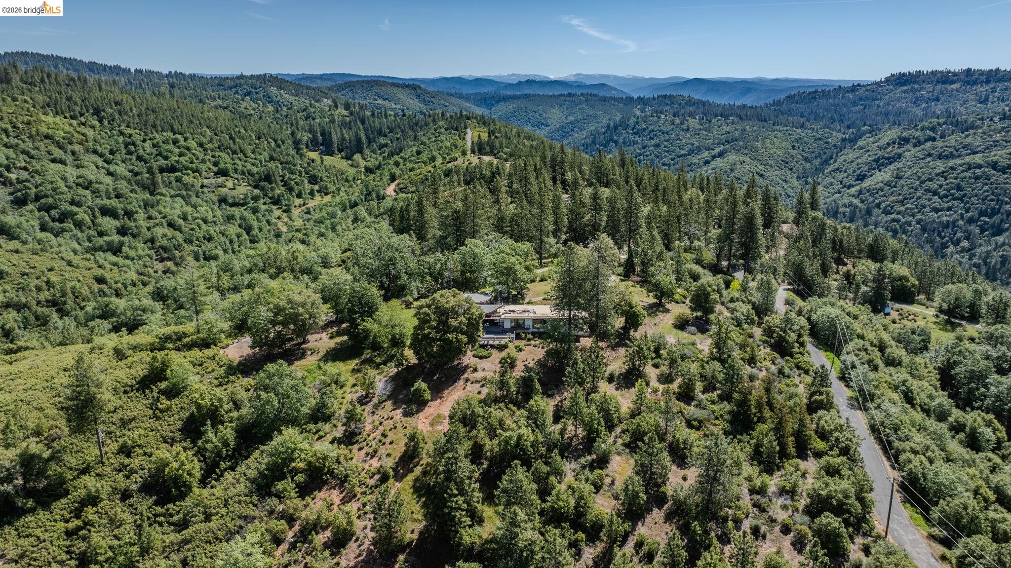 6161 Fullen Road Murphys, CA 95247 - Photo 52 of 53 a view of a lush green forest with trees and houses