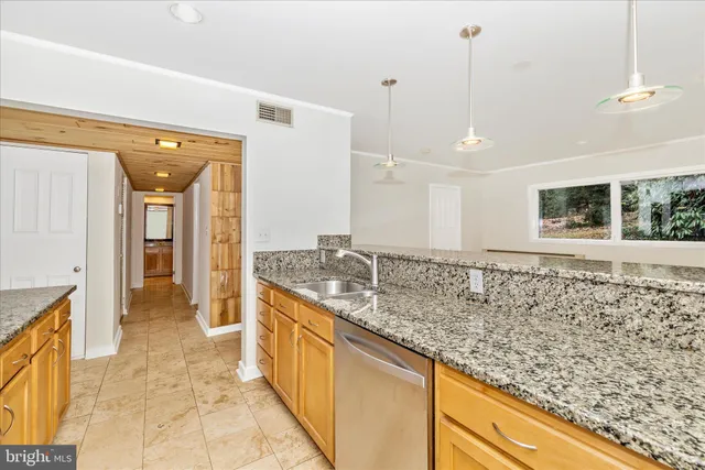 a view of an empty room with windows