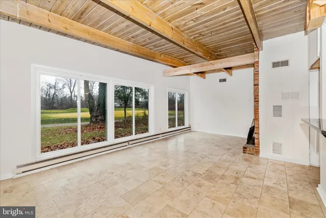 a view of a hallway with windows