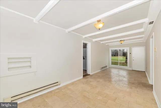 a bathroom with a granite countertop toilet and a sink