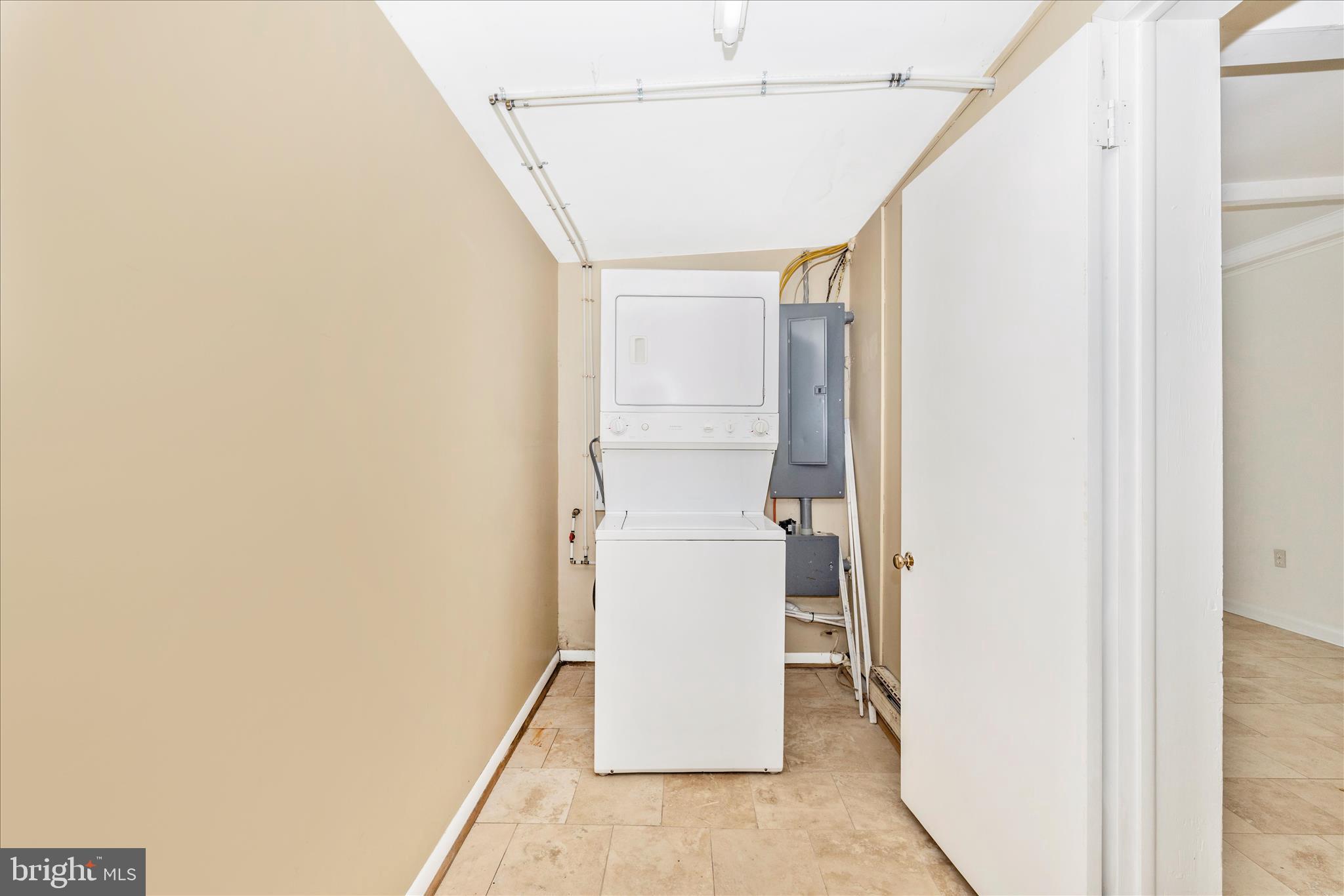 12819 Fountain Head Road Hagerstown, MD 21742 - Photo 26 of 65 a utility room with wooden floor and white wall