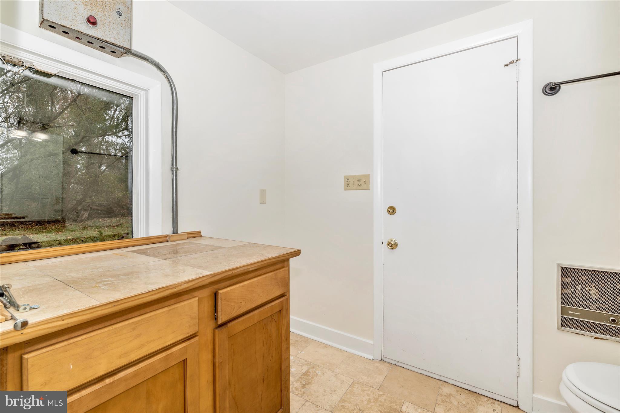 12819 Fountain Head Road Hagerstown, MD 21742 - Photo 33 of 65 a bathroom with a granite countertop sink and a mirror