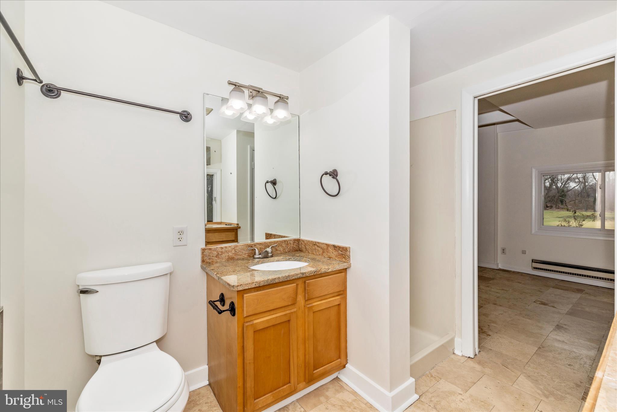 12819 Fountain Head Road Hagerstown, MD 21742 - Photo 34 of 65 a bathroom with a granite countertop sink toilet and shower