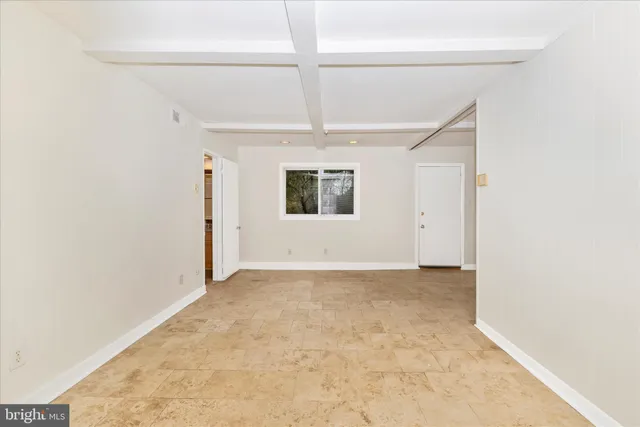 a view of a house with backyard and trees
