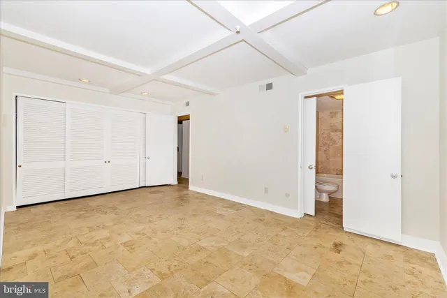 a view of a swimming pool with an outdoor space and seating area