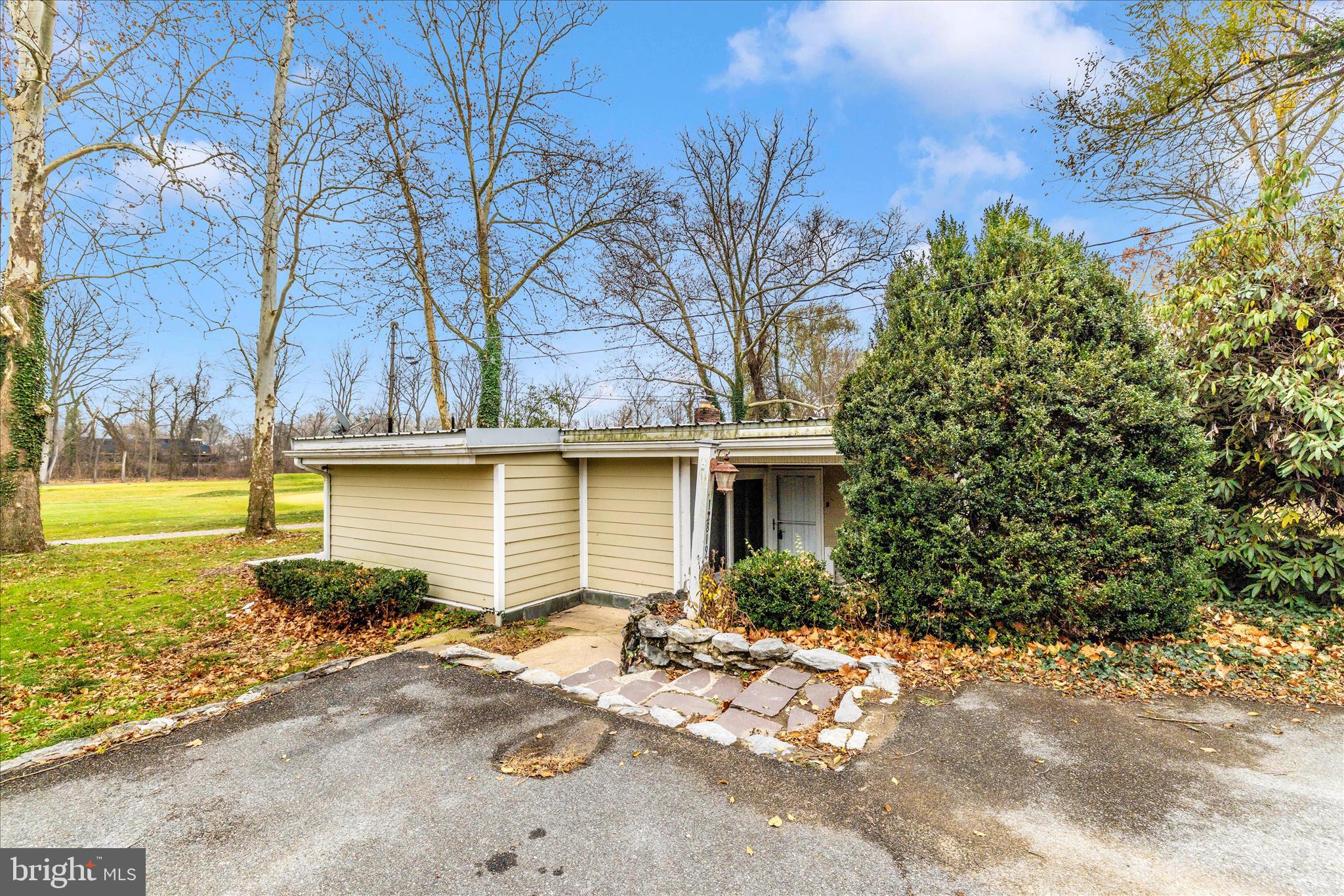 12819 Fountain Head Road Hagerstown, MD 21742 - Photo 41 of 65 a front view of a house with garden