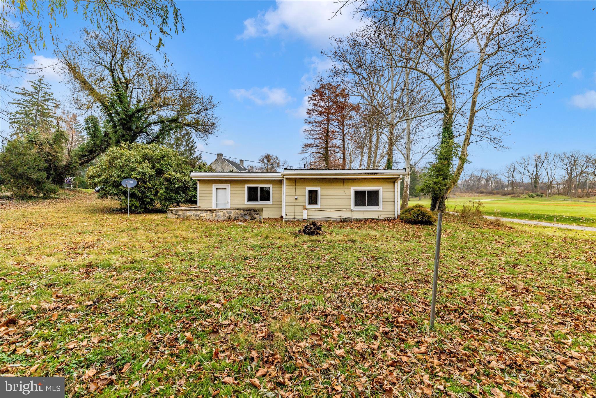 12819 Fountain Head Road Hagerstown, MD 21742 - Photo 46 of 65 a view of a house with backyard and trees