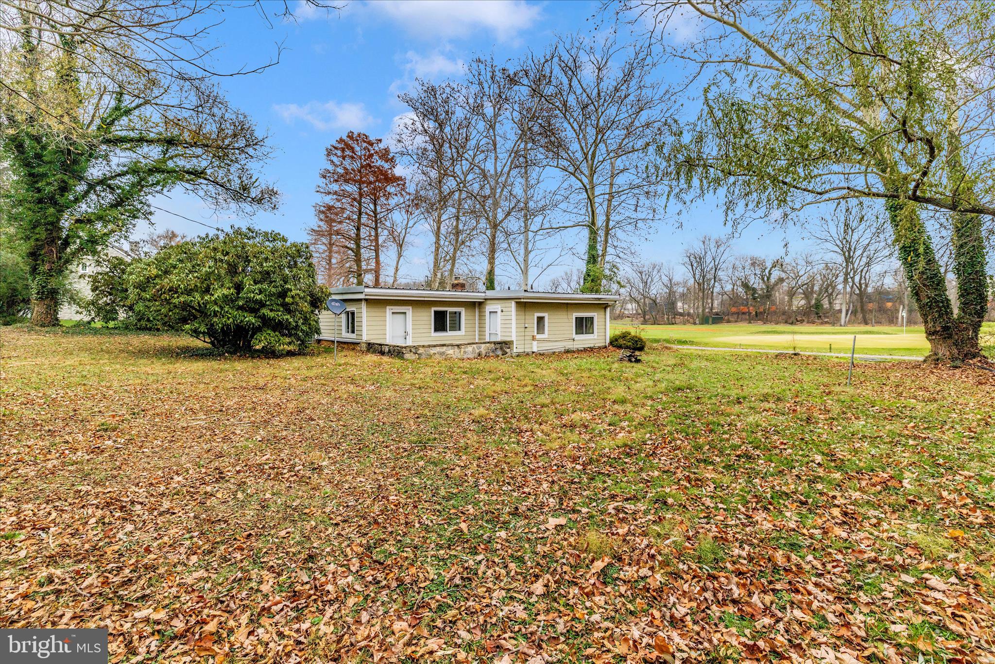 12819 Fountain Head Road Hagerstown, MD 21742 - Photo 48 of 65 a view of a swimming pool with an outdoor space and seating area