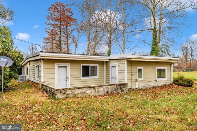 a view of a swimming pool with an outdoor space and seating area