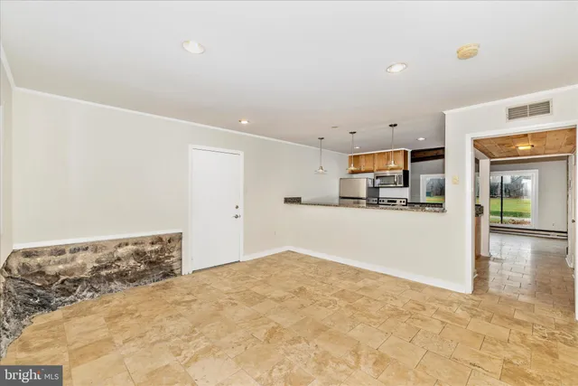 a kitchen with stainless steel appliances granite countertop a sink and a stove