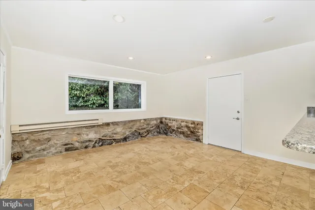 a kitchen with stainless steel appliances granite countertop a sink and a stove