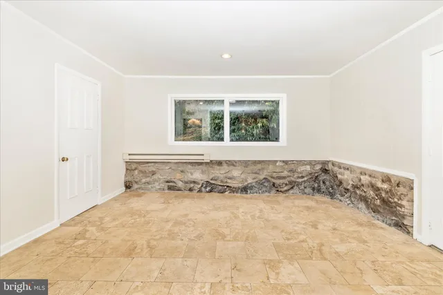 a kitchen with stainless steel appliances granite countertop a sink and a refrigerator