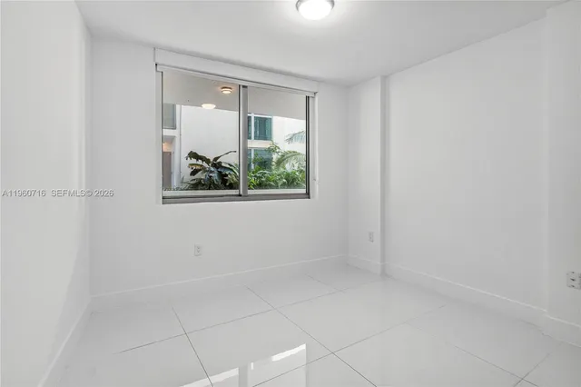 a view of an empty room and window