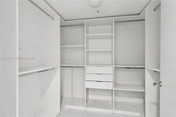 a bathroom with a double vanity sink and mirror