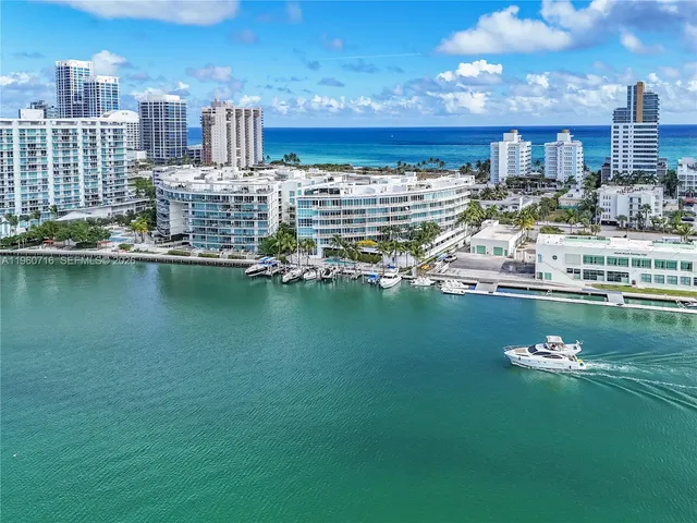 an aerial view of a house with a lake view