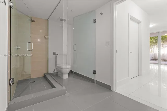 a view of a hallway with washer and dryer