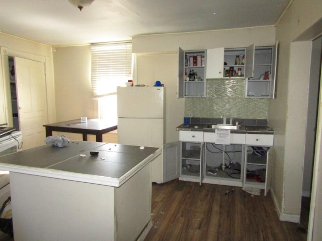 215 Anthony Street Pittsburgh, PA 15210 - Photo 18 of 39 a room with table chairs and refrigerator