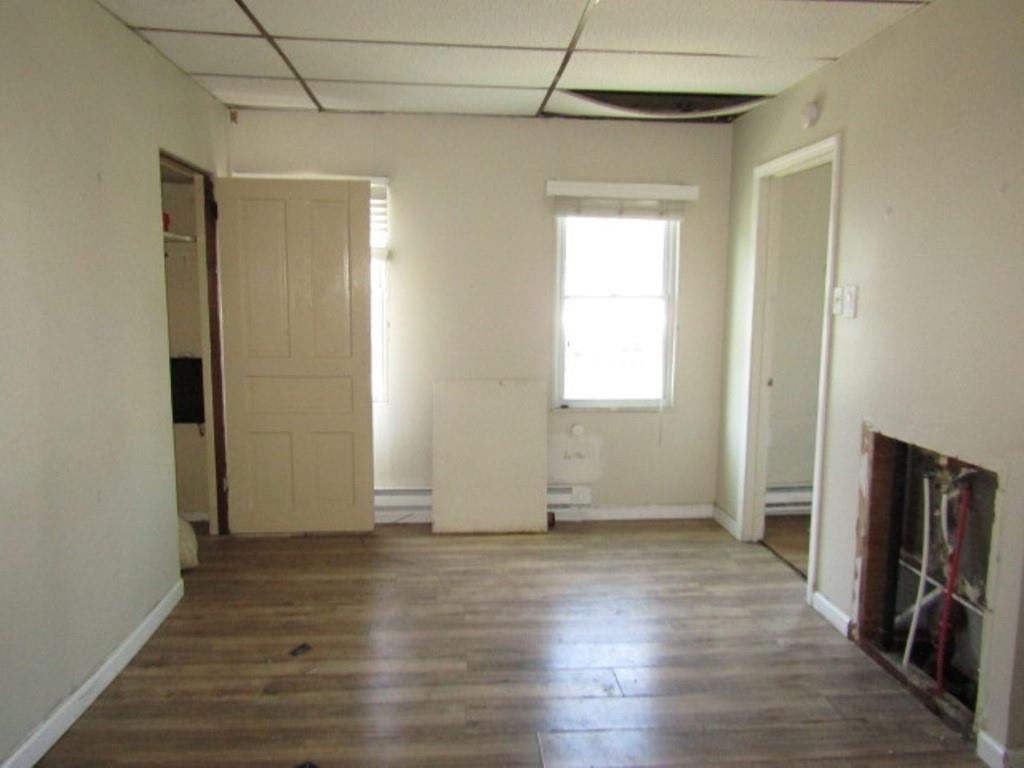 215 Anthony Street Pittsburgh, PA 15210 - Photo 21 of 39 an empty room with wooden floor and a window