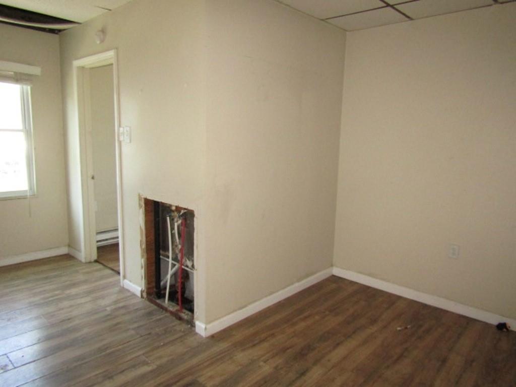 215 Anthony Street Pittsburgh, PA 15210 - Photo 22 of 39 a view of a hallway with wooden floor and closet
