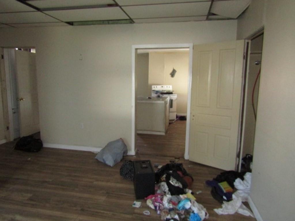 215 Anthony Street Pittsburgh, PA 15210 - Photo 23 of 39 a room that has a bed and a dresser in it