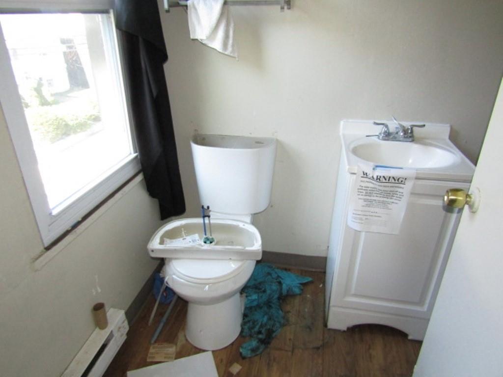 215 Anthony Street Pittsburgh, PA 15210 - Photo 24 of 39 a bathroom with a sink toilet and vanity