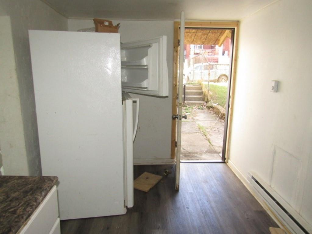 215 Anthony Street Pittsburgh, PA 15210 - Photo 31 of 39 a view of walk in closet with wooden floor