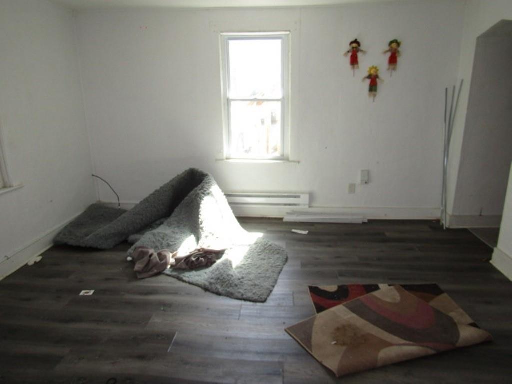 215 Anthony Street Pittsburgh, PA 15210 - Photo 32 of 39 a living room with wooden floor and furniture