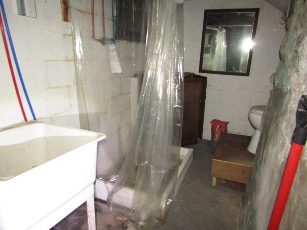 215 Anthony Street Pittsburgh, PA 15210 - Photo 39 of 39 a bathroom with a sink a toilet and shower