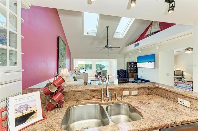 a view of a chairs and table in patio with a yard
