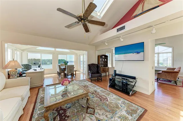 a view of a house with backyard and porch