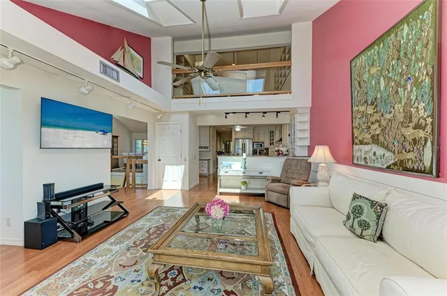 an aerial view of a house with a garden and lake view