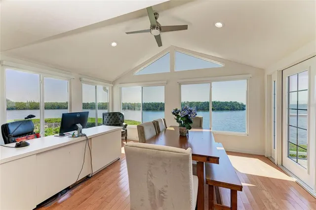 an aerial view of a house with a lake view