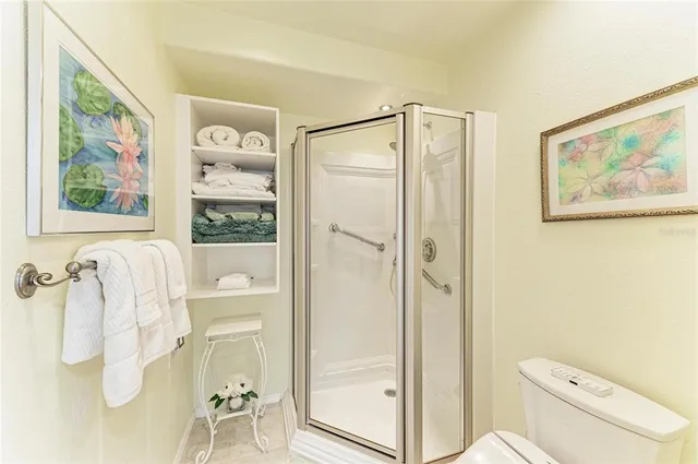 a view of a patio with a dining table and chairs with wooden floor