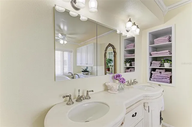 a view of swimming pool with outdoor seating and plants