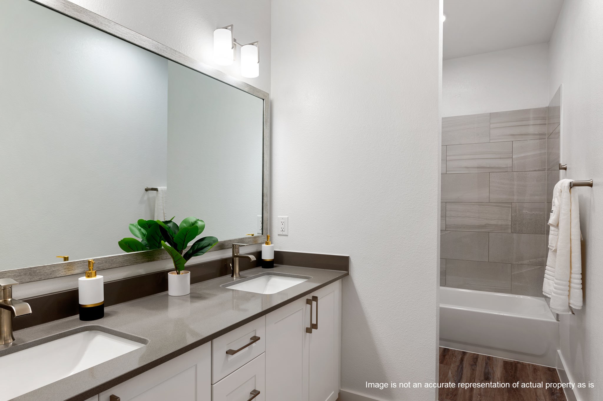 28328-613 Birnham Woods Drive Spring, TX 77386 - Photo 22 of 38 a bathroom with a granite countertop sink a mirror and a bathtub
