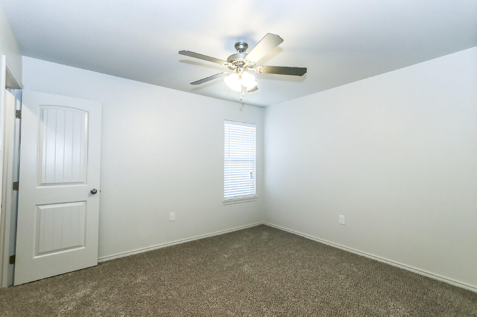 6905 67th Street, Unit B Lubbock, TX 79424 - Photo 35 of 37 a view of an empty room with a window