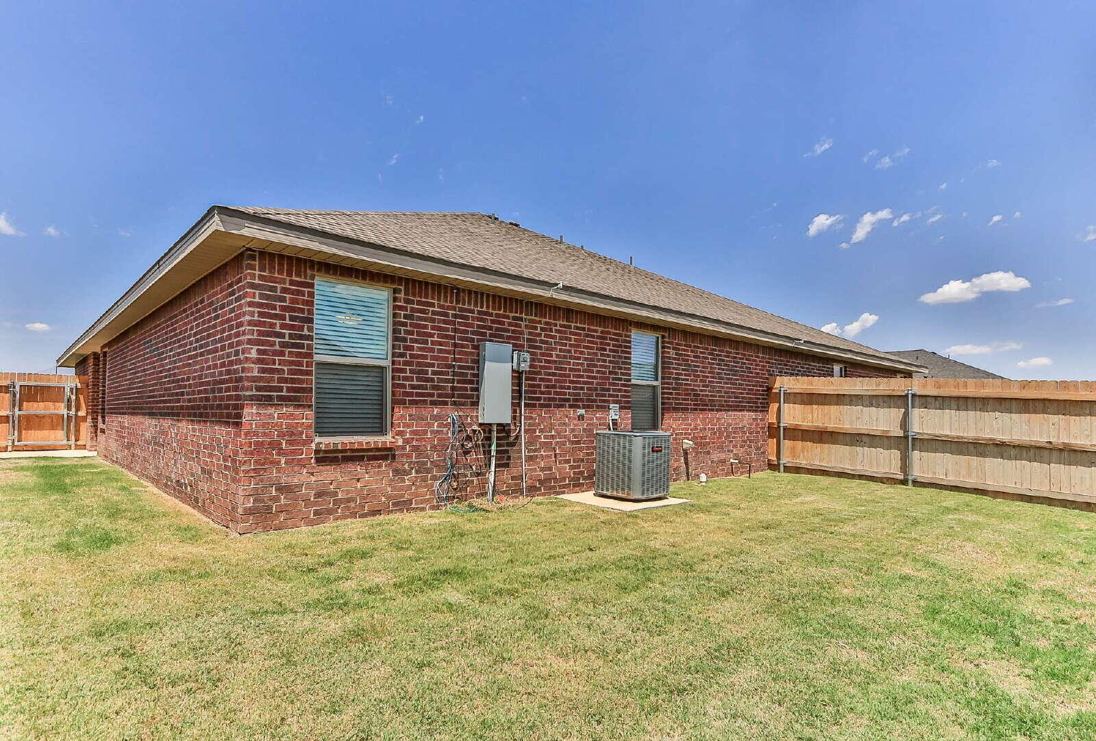 6905 67th Street, Unit B Lubbock, TX 79424 - Photo 37 of 37 a front view of house with yard and seating area