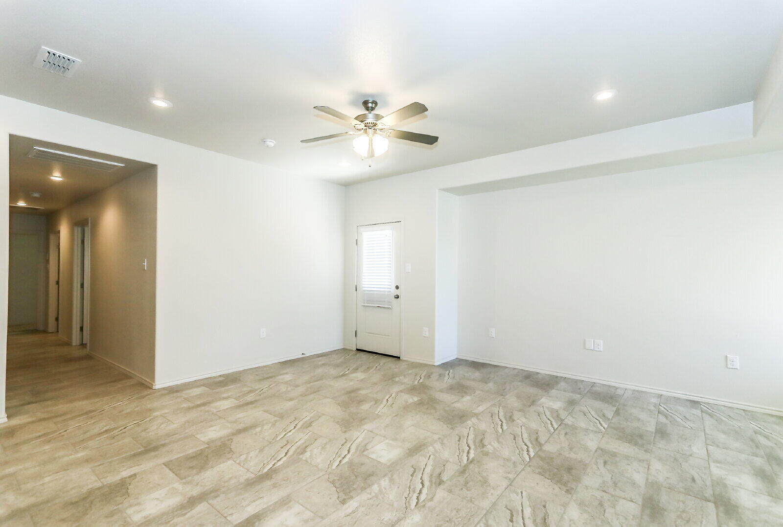 6905 67th Street, Unit B Lubbock, TX 79424 - Photo 5 of 35 an empty room with closet and a chandelier fan
