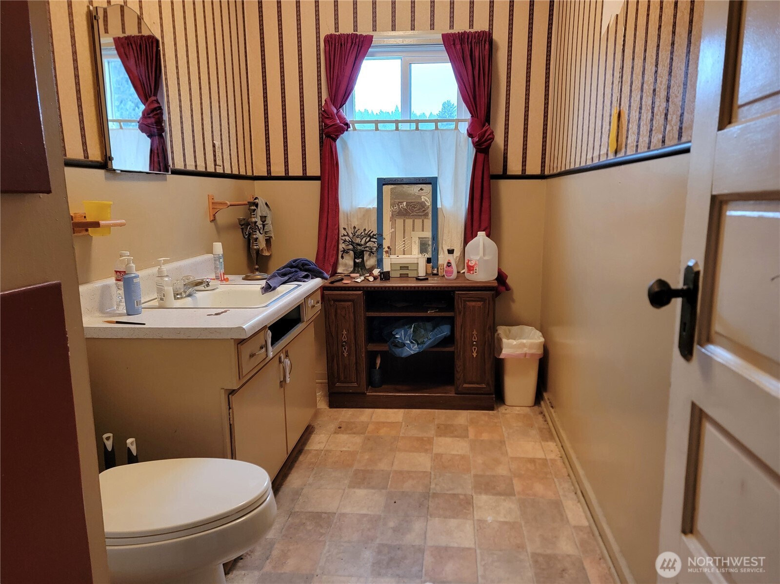 166 North Jefferson Street Republic, WA 99166 - Photo 11 of 20 a bathroom with a sink a toilet and mirror