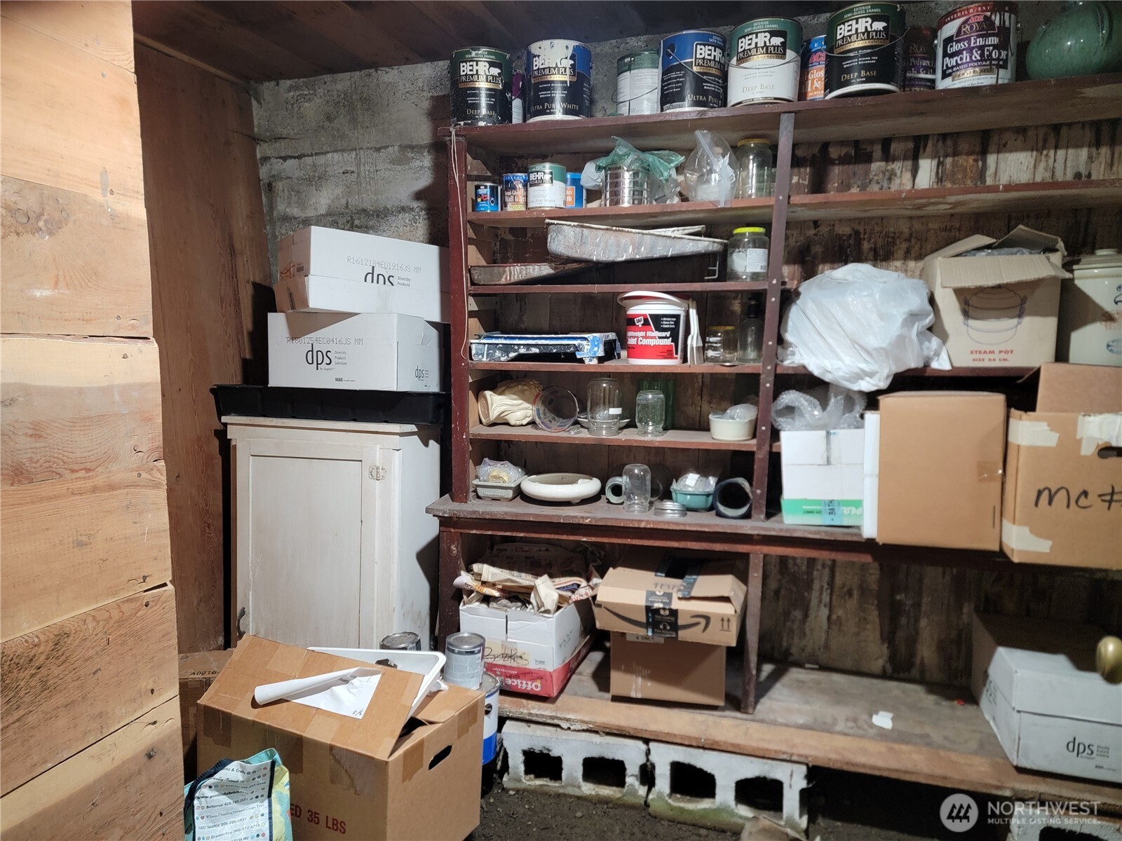 166 North Jefferson Street Republic, WA 99166 - Photo 17 of 20 a room with wooden floor and shoes