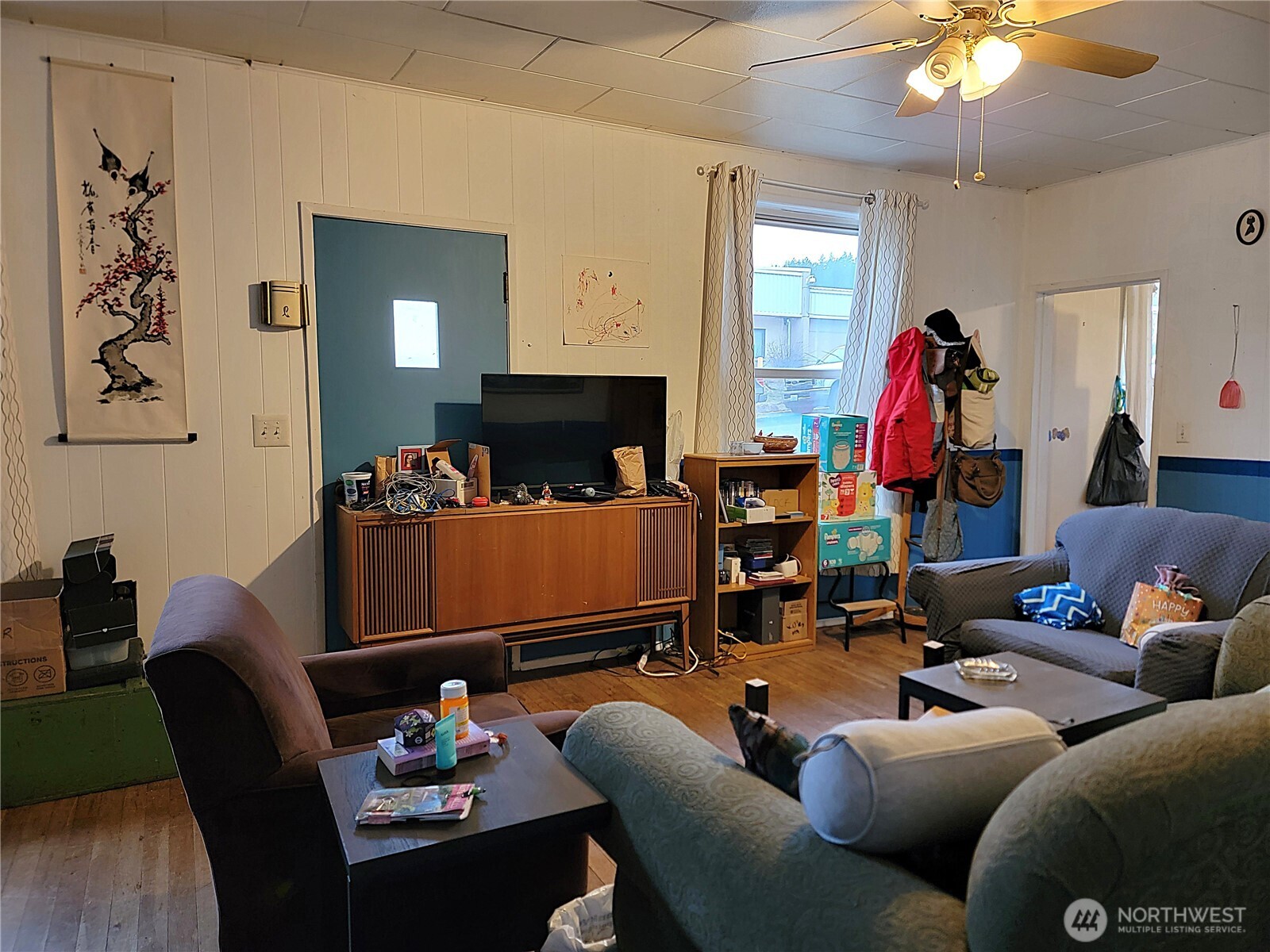 166 North Jefferson Street Republic, WA 99166 - Photo 6 of 20 a living room with furniture and a fireplace
