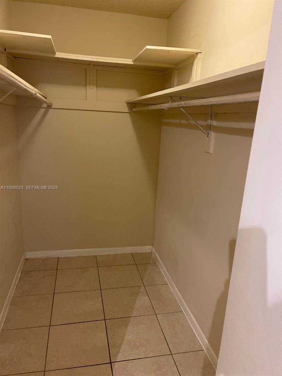 718 Southwest 7th Street, Unit 718 Hallandale Beach, FL 33009 - Photo 10 of 13 a view of a room with an empty space and the shower