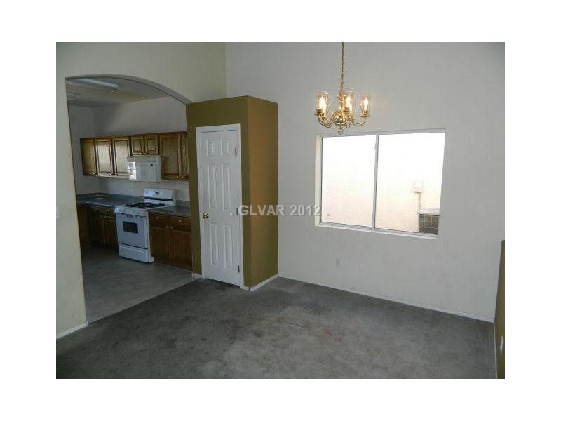5959 Crumbling Ridge Street Henderson, NV 89011 - Photo 5 of 35 Dining Room. DINING AREA OPEN TO THE KITCHEN