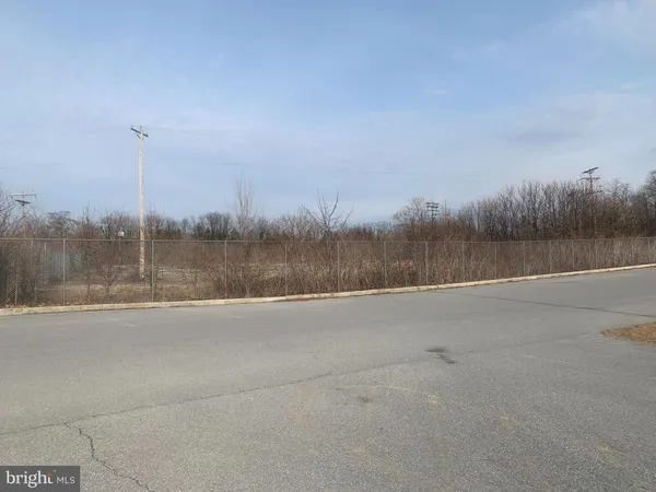 a view of a basket ball ground in front of residential house