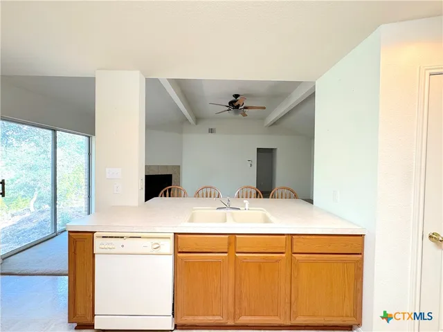 a room with a sink vanity and mirror