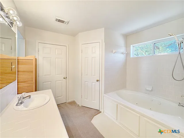 a view of a hallway with a white door