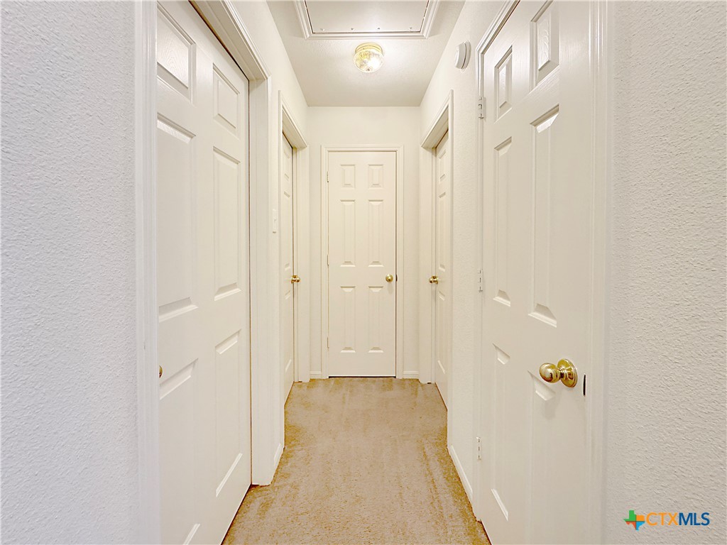 4575 Tanglewood Trail Spring Branch, TX 78070 - Photo 26 of 48 a view of a hallway with a white door
