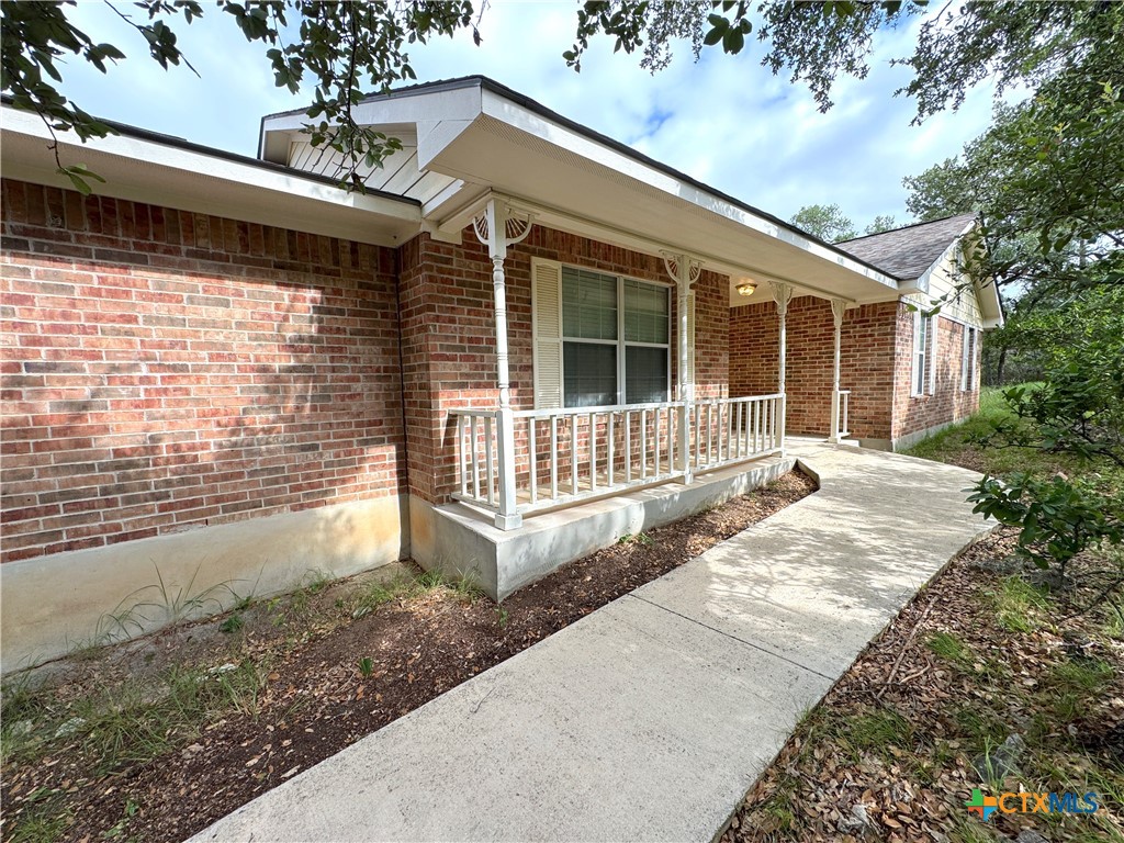 4575 Tanglewood Trail Spring Branch, TX 78070 - Photo 3 of 48 a view of house with backyard and deck